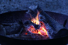 Load image into Gallery viewer, 23.5" Dia. Hand Riveted Steel Fire Pit With Grill Grate and Stand Nomadic Grill + Home Fire At Night