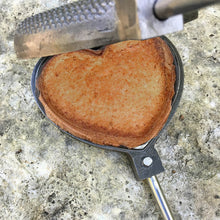 Load image into Gallery viewer, Rome Love Pie Iron with cooked heart sandwich close up gray background