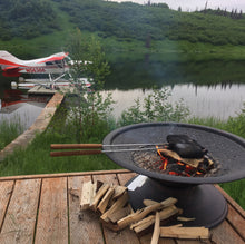 Load image into Gallery viewer, Rome Double Iron Iron in use over fire pit on fishing dock