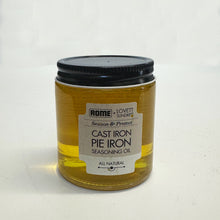 Load image into Gallery viewer, Jar of Rome cast iron pie iron seasoning oil with a black lid on a white background