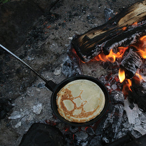 Family Campfire Skillet Cast Iron - Original By Rome closeup cooking head with pancake