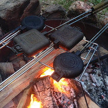 Load image into Gallery viewer, Pie Iron Campfire Stand with pie irons on campfire