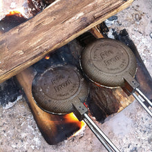 Load image into Gallery viewer, Round Cast Iron Pie Iron - Original By Rome closeup cooking head on wood