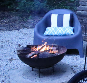 23.5" Dia. Stamped Steel Fire Pit W/ Grill Grate and Stand Nomadic Grill + Home outside view with fire